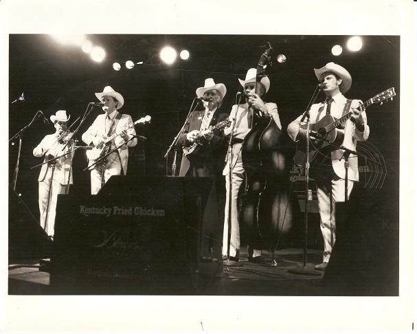 Item #030973 PROFESSIONAL PHOTOGRAPH OF BILL MONROE AND HIS BLUEGRASS BOYS:; 8x10 glossy photo of the group playing onstage. Bill Monroe.