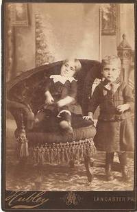 Item #033784 CABINET CARD PHOTO OF A TODDLER IN AN ELABORATE VICTORIAN CHAIR, AND A STANDING YOUNG BOY:; Handwritten label on back identifies "Brother Harry Eshbach & Sister Grace Eshbach." Harry and Grace Eshbach.