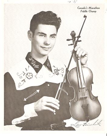 Item #035614 PROFESSIONAL PHOTOGRAPH OF THE YOUNG LEN FAIRCHUK IN AN EMBROIDERED WESTERN SHIRT, HOLDING HIS FIDDLE AND BOW. Len Fairchuk, White Buffalo.