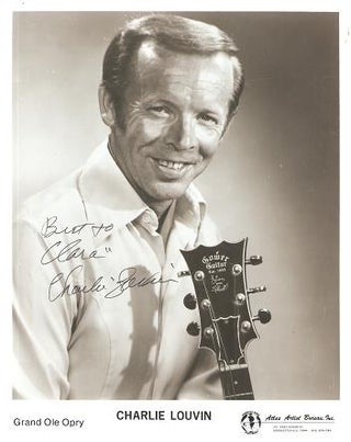 Item #035773 SIGNED, PROFESSIONAL PHOTOGRAPH OF CHARLIE LOUVIN OF THE GRAND OLE OPRY. Charlie Louvin