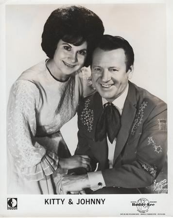Item #036040 PROFESSIONAL PHOTOGRAPH OF KITTY & JOHNNY:; Country & Western performers. Kitty Wells, Johnny Wright.