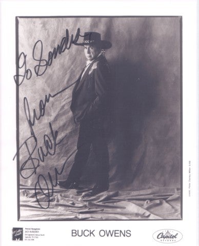 Item #BOOKS016495I PROFESSIONAL, SIGNED PHOTOGRAPH OF BUCK OWENS:; in elaborate western suit, hat and boots. Buck Owens.